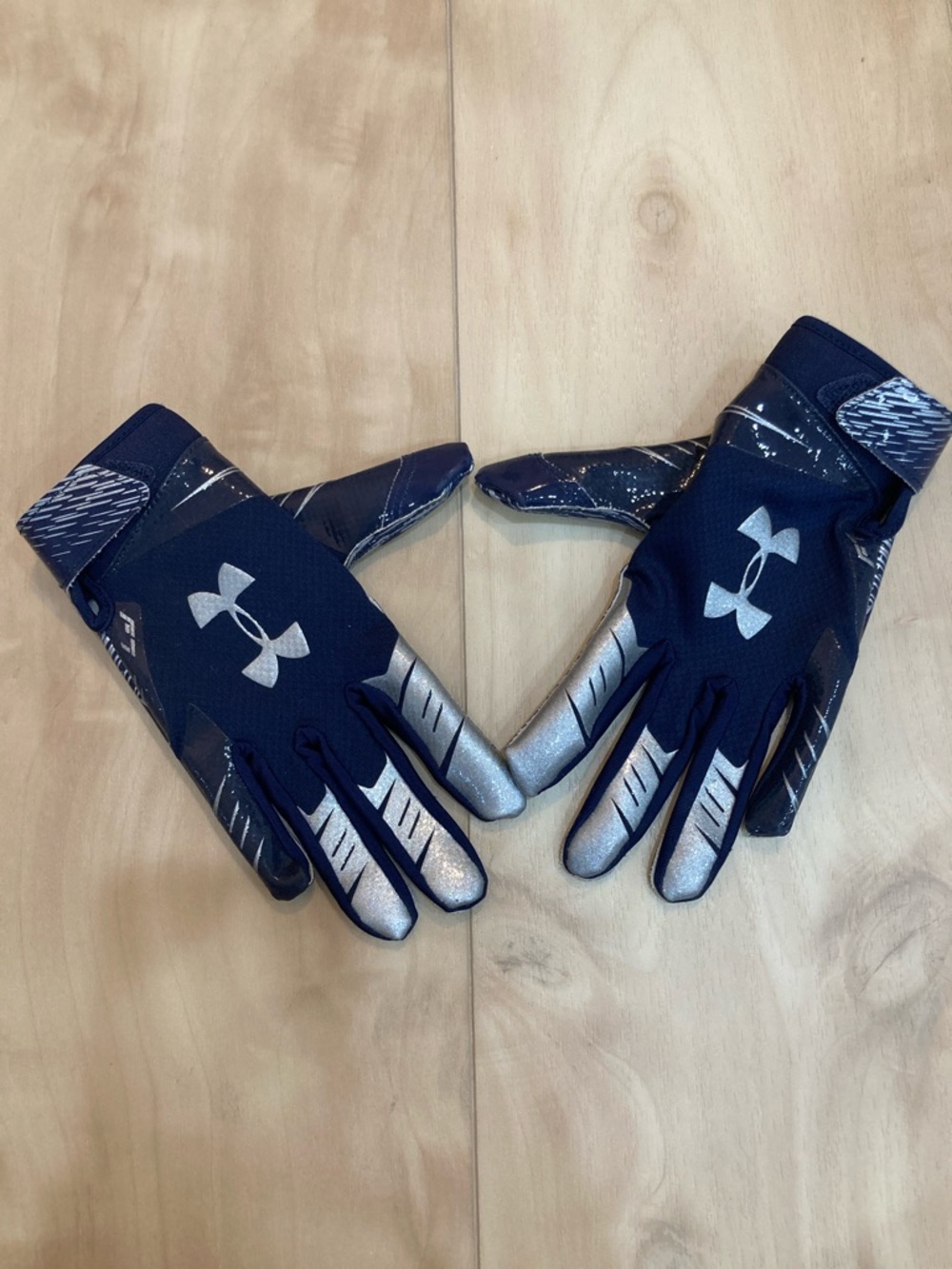UA Youth football gloves